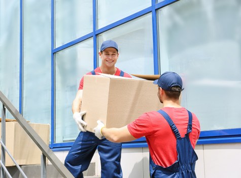 Customer placing items into a storage unit at Hadleywood Storage